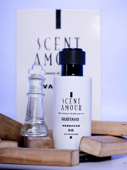 Perfume bottle labeled 'Scent Amour Gustavo' with a chess piece and wooden pieces on a light background