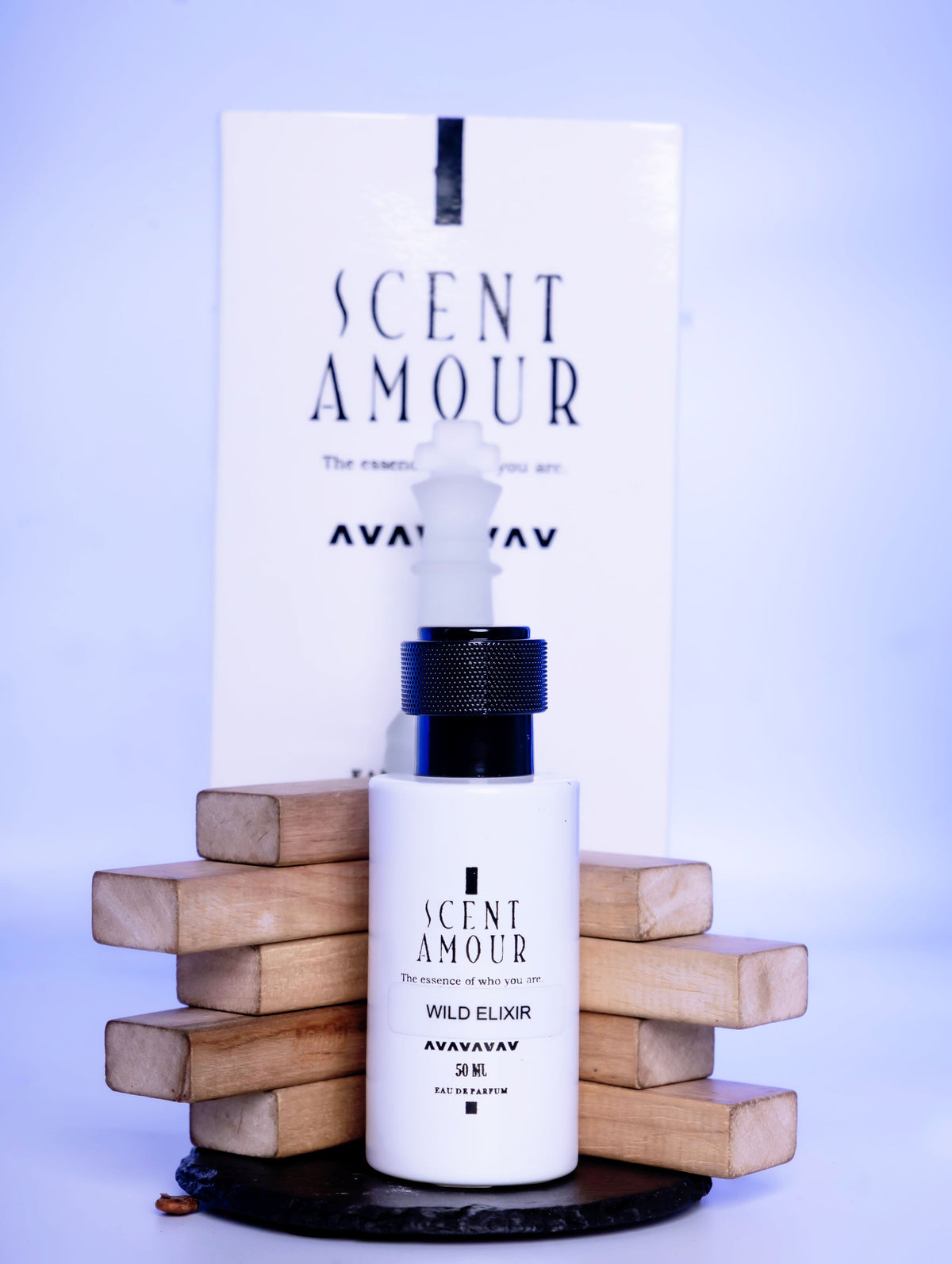 Scent Amour Wild Elixir bottle and packaging on a light blue background